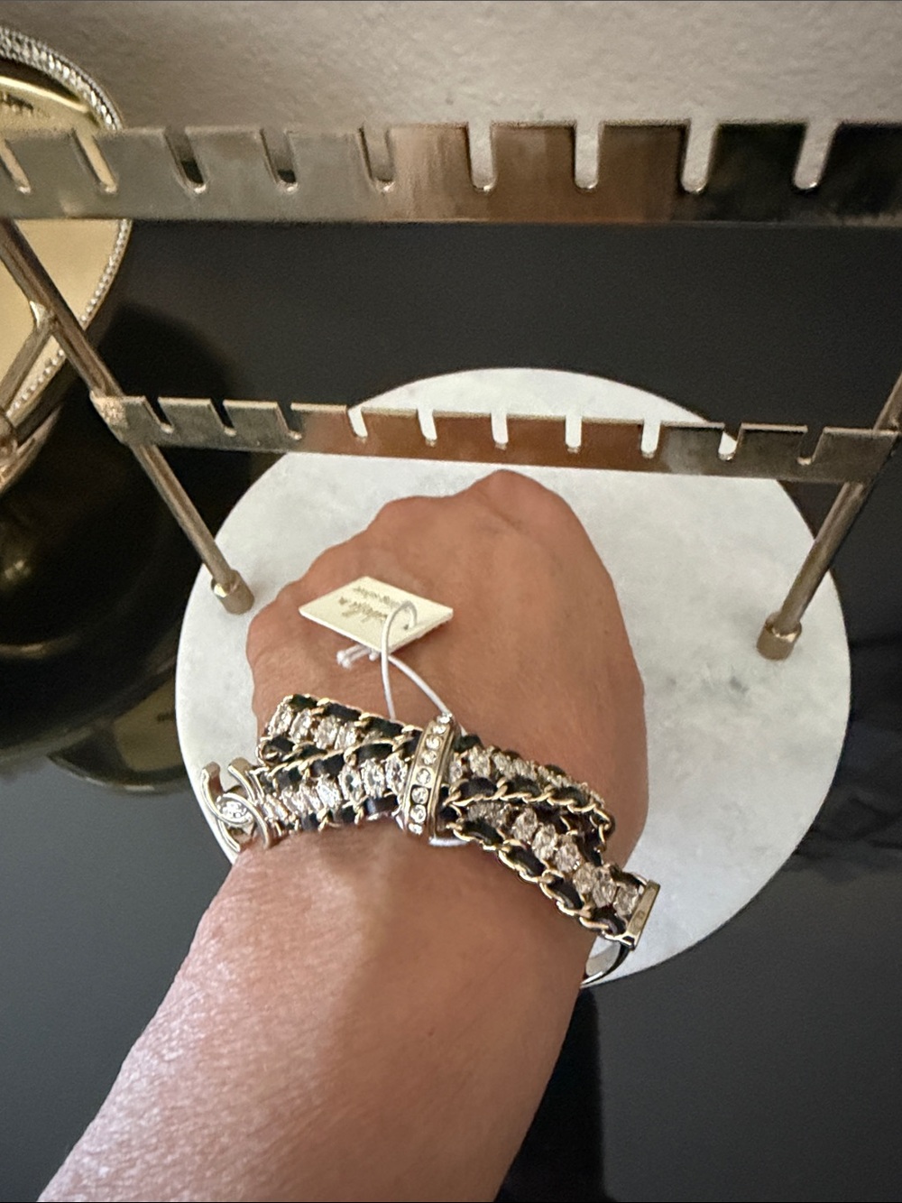 Rhinestone Chain Link Bracelet in gold tone and Black with C C logo.